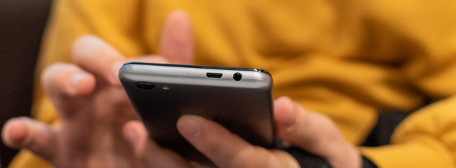 mobile phone held in a Childs hand 