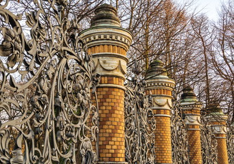 Old openwork wrought iron fence of  Mikhailovsky Park in St. Petersburg