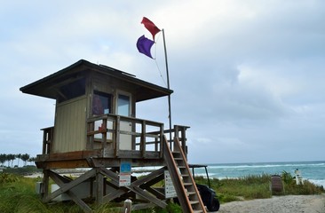 Fototapeta na wymiar flag on mast lifeguard tower