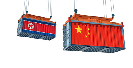Freight container with China and North Korea flag - isolated on white. 3D Rendering