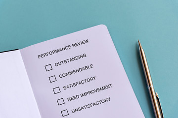 Performance review checklist text on blue background
