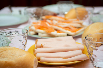 ham and cold cuts on a laid table