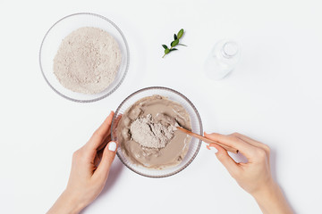Top view woman's hands mix clay