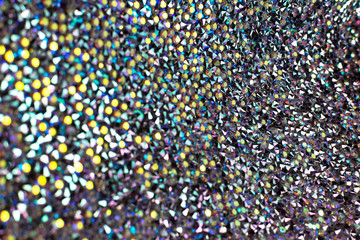 Bokeh light, flickering blur spots on a colorful abstract background.