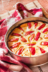 Sweet cottage cheese casserole with apples in a tin baking dish