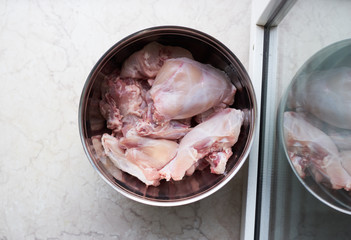 Raw rabbit meat in an iron bowl