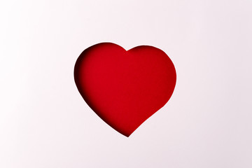 Paper red heart,red background, minimalistic Valentine's day symbol