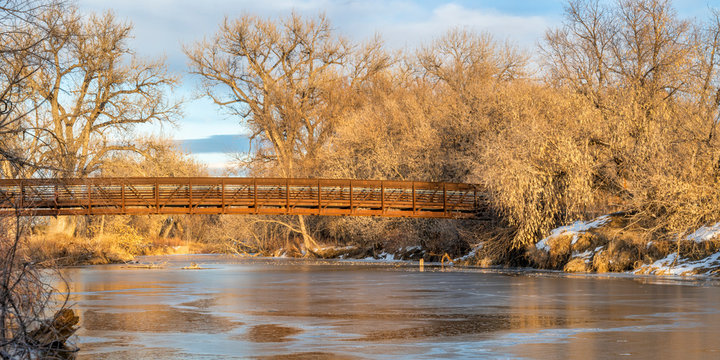 Footbridge Over Frozen River -  Poudre River Trail