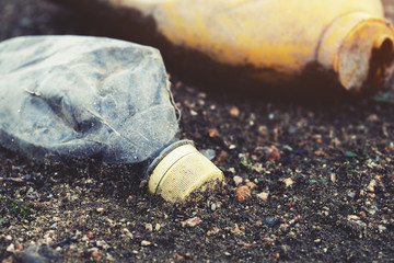 Obraz premium environmental pollution, ecological problem, spilled plastic garbage on the ground, waste, earth, ocean pollution