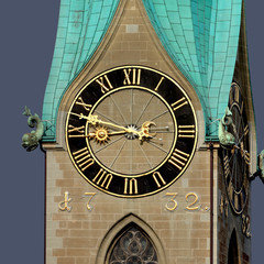 Clock at Fraumünster Monastery in Zürich. Golden roman numbers and fingers on black scale. 