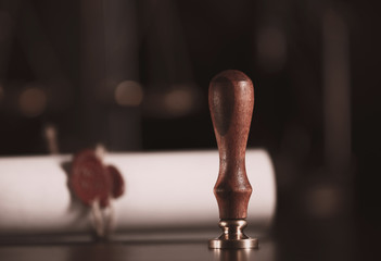Notary's public pen and stamp on testament and last will. Notary public tools.Closeup of an ancient...