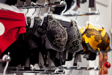 Fototapeta na wymiar Shop woman underwear clothes, Lingerie on rack. Retail shop, store