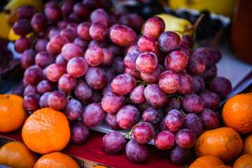 pink rose fresh grapes close up view