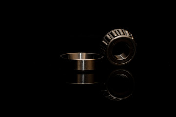 Angular contact roller bearing on black background