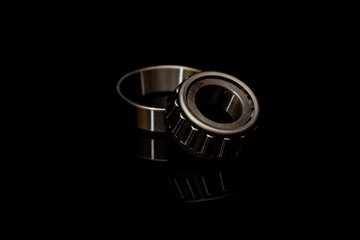 Angular contact roller bearing on black background
