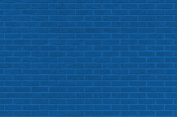 Brick wall texture in color classic blue. Color of the 2020 year. Brick wall with microcracks. Monochrome photo.