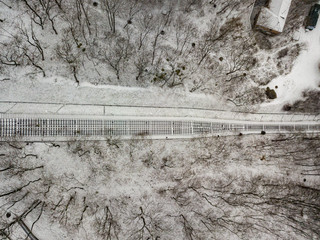 Aerial drone view. Funicular railway among a snowy park.