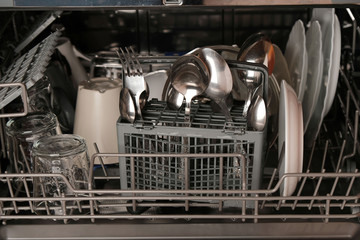 Dishwasher close-up, clean dishes after washing, household appliances for the kitchen