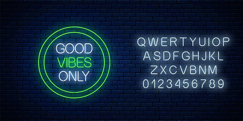 Good vibes only - glowing neon inscription phrase in green circle frame with alphabet. Motivation quote in neon style.
