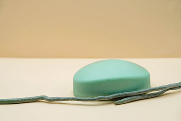 Pastel image. Unusual combination of soap Aqua Menthe  and orchid root. Mockup. Copy space. Minimalism.
