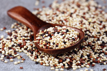 Set of quinoa Red, white and brown quinoa in a wooden spoon. healthy food