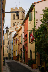 Fototapeta na wymiar Multi colored alley with steeple