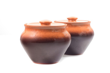 brown ceramic pots on white isolated background