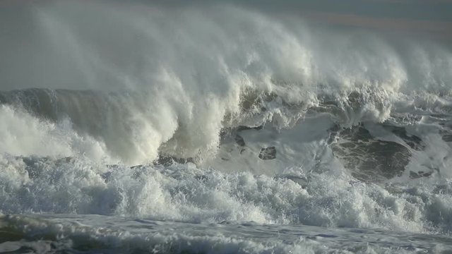 Sea big wave sea spray foam blue sky