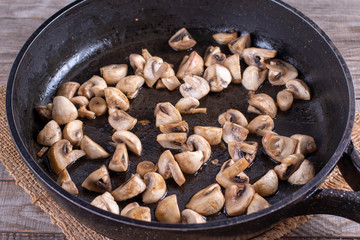 Fried mushrooms in frying pan