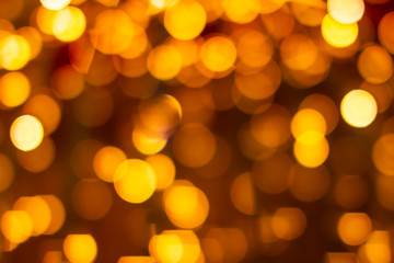 Orange bokeh defocused blurred lights. Abstract background