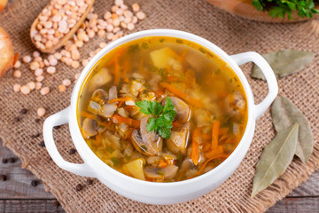Bowl of pea soup with mushrooms