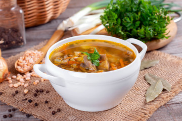 Bowl of pea soup with mushrooms