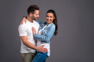 Fototapeta premium Nice young couple in the studio