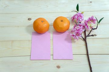 Accessories on Lunar New Year & Chinese New Year.Orange on the table wood .