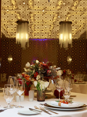 Table setting with fork, knife, plates and glass