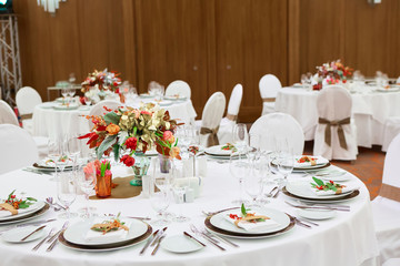 catering table set service with silverware, napkin and glass at restaurant before party