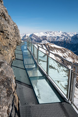 The Thrill Walk at Birg in the Swiss Alps. The steel structure hugs the cliff side and there is a vertical drop beneath. The views of the mountains are stunning. Not for the faint hearted.