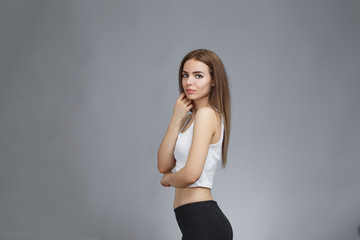 girl posing on gray background