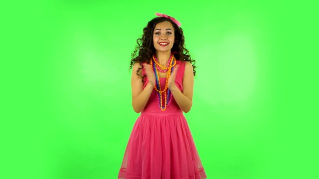 Girl claps her hands with wow happy joy and delight. Green screen