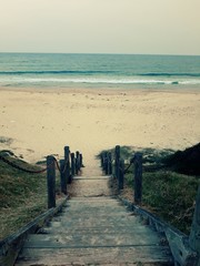 stairs down to a glamorous beach