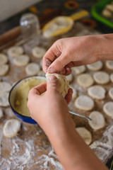 Cooking dumplings at home, the woman prepares lunch.