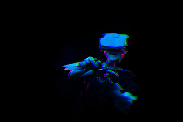 Man with virtual reality headset is playing game. Image with glitch effect.