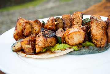 Chicken skewers fried in sesame oil, cuisine with oriental flavor in Guatemala, Central America.
