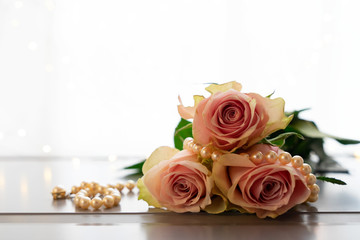 fresh rose flowers on gray