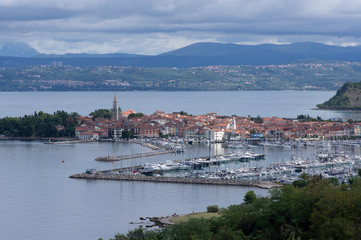 Izola / Slovenia - September 9, 2019: Aerial view over the sea beautiful Izola town, with old town and harbor