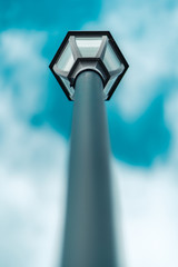 Lamp Post with Shallow Depth of Field on Cyan Sky Looking Up