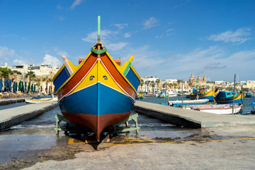 A luzzu is a traditional fishing boat from the Maltese islands. Painted in bright colours, luzzus have existed sin