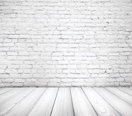 Room with cracked brick wall