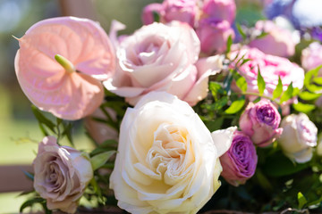 Bouquets of fresh flowers decoration of the festive table. Celebrating an open air party. Decor Details