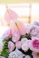 Bouquets of fresh flowers decoration of the festive table. Celebrating an open air party. Decor Details